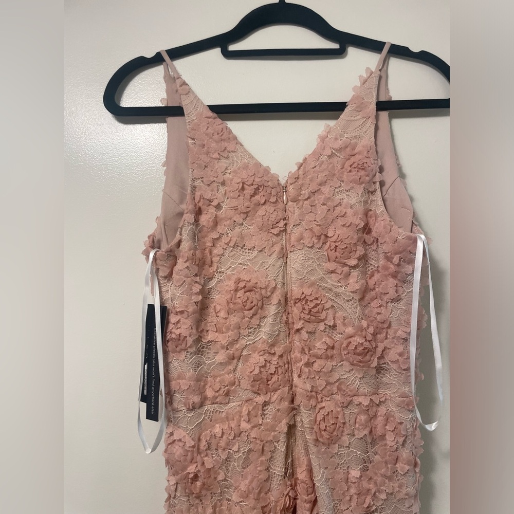 Avery G. Size 6. Nude pink flower detail floor length gown.